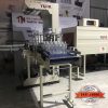 Máy co màng lốc chai lon nước tự động