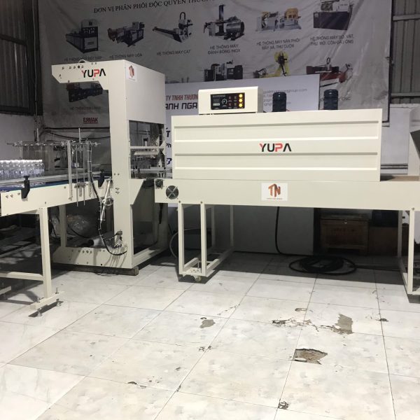 Máy co màng lốc chai lon nước tự động
