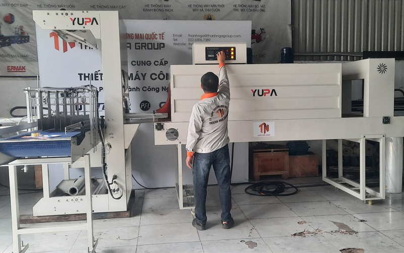 Máy co màng lốc chai lon nước tự động